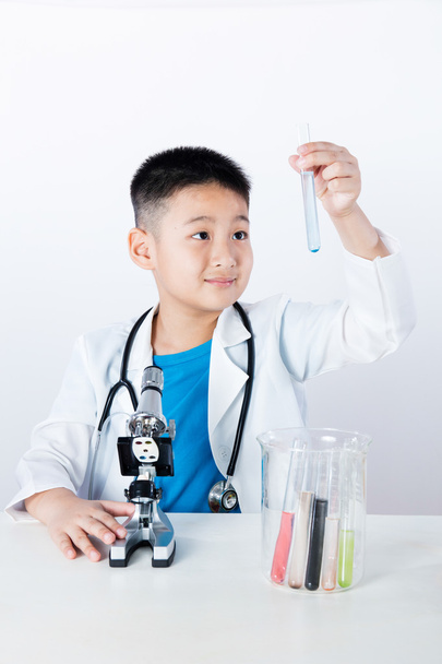Asian Chinese boy holding test tube for research - Фото, зображення