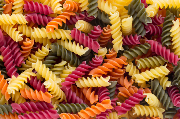 Closeup of raw eco macaroni pasta background.  - Фото, зображення