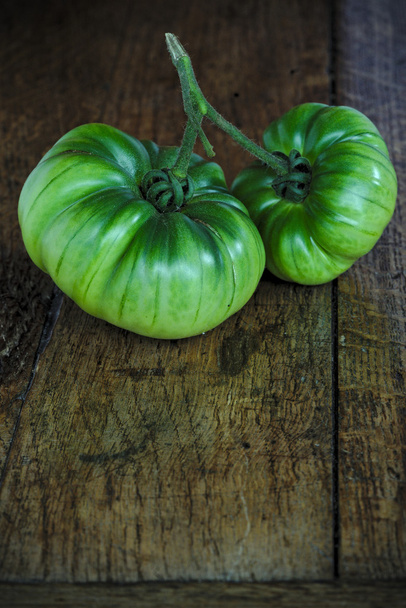Green Black Krim tomato on a wooden farm table  - Фото, зображення