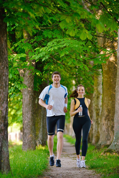 Young couple jogging - Фото, изображение