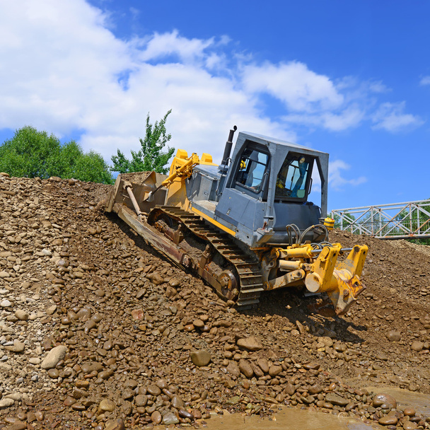 Le bulldozer sur un chantier
 - Photo, image