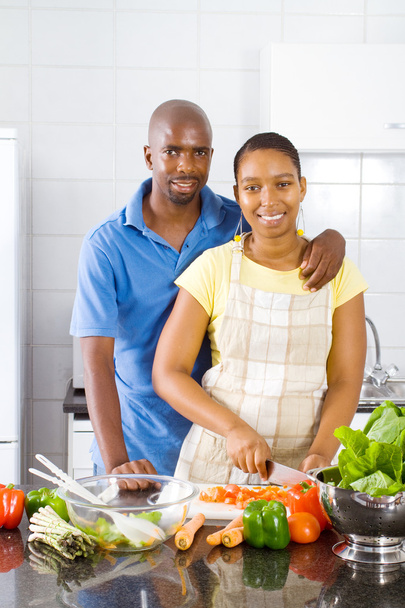African american couple cooking in kitchen - Foto, afbeelding