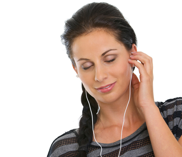 Portrait of girl with headphones relaxing by listening music - Foto, Imagem