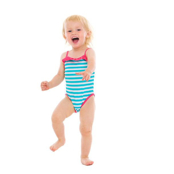 Portrait of cheerful baby in swimsuit - 写真・画像