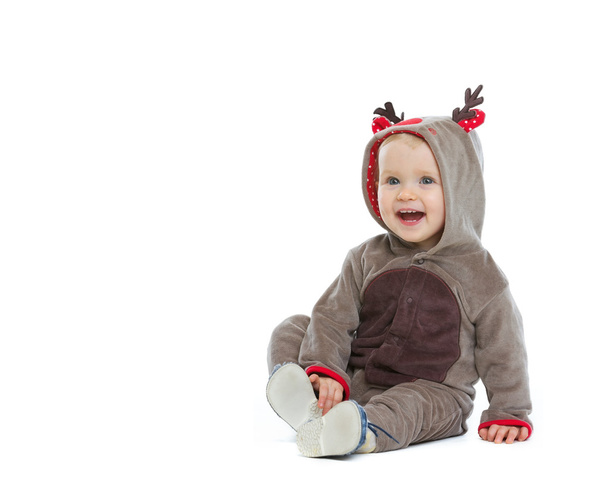 Smiling baby in Christmas costume looking on copy space - Foto, immagini