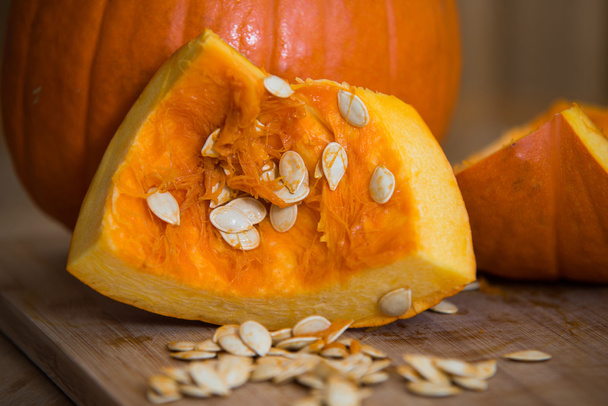 close up on Pumpkin slices with seeds - Foto, afbeelding