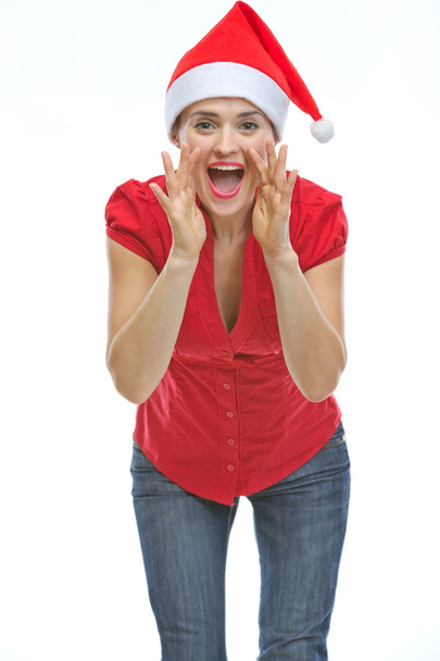 Mujer joven en sombrero de Navidad gritando a través de megáfono en forma h
 - Foto, Imagen