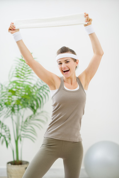 Portrait of cheerful woman in sportswear with towel - Photo, Image