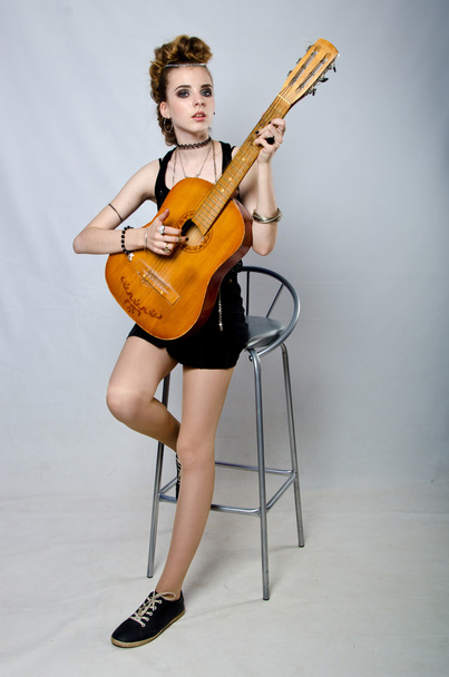 girl playing the guitar - 写真・画像
