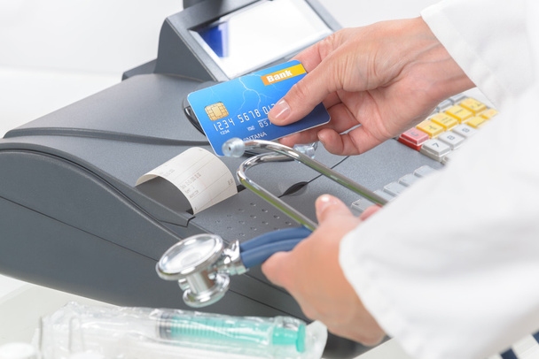 pharmacist or medical doctor using cash register - Photo, Image
