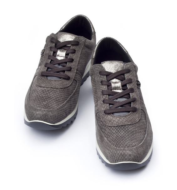 Sneakers grigie femminili scamosciate isolate su sfondo bianco
  - Foto, immagini