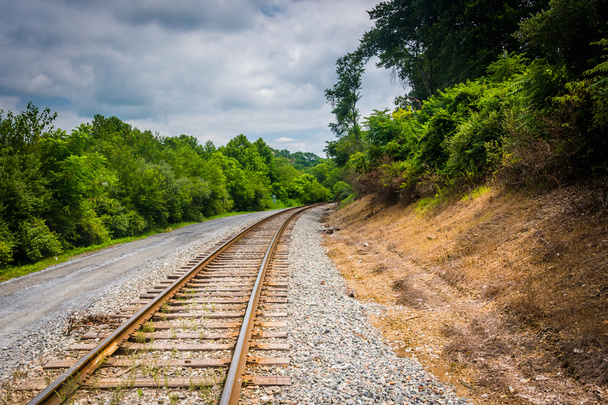 Dirt road and railroad track in rural Carroll County, Maryland. - 写真・画像