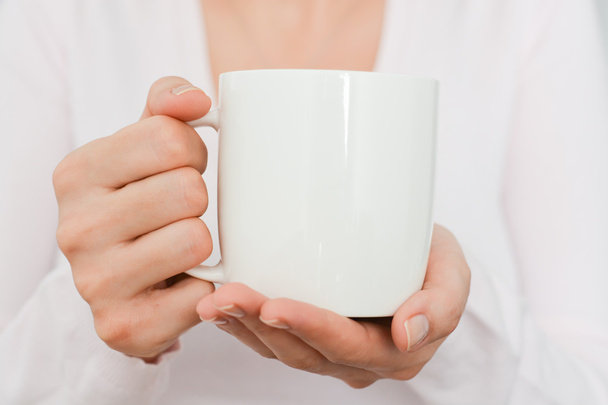 white coffee cup held by woman - Foto, Imagen