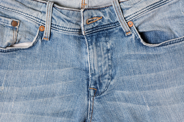 Niebieskie spodnie jeansowe z bliska tło - Zdjęcie, obraz
