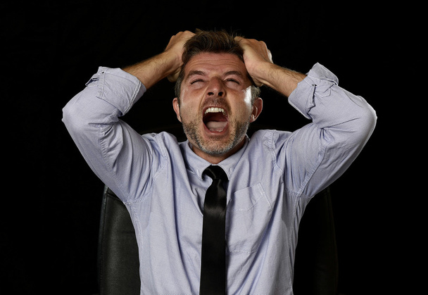 young crazy stressed businessman in worried tired face expression screaming desperate - 写真・画像