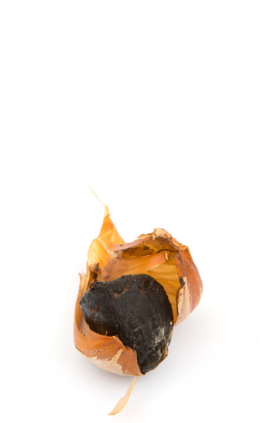 Caramelized cloves of black garlic  - Photo, Image