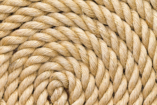 Rope background texture neatly wound into a coil - Foto, imagen