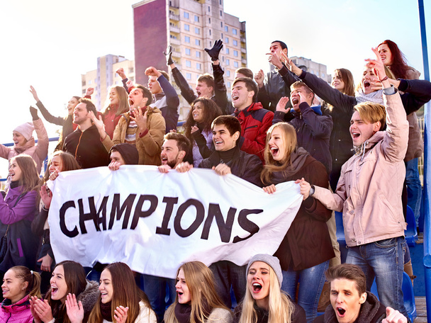 Sport fans keep champion banner on tribunes. - Photo, Image