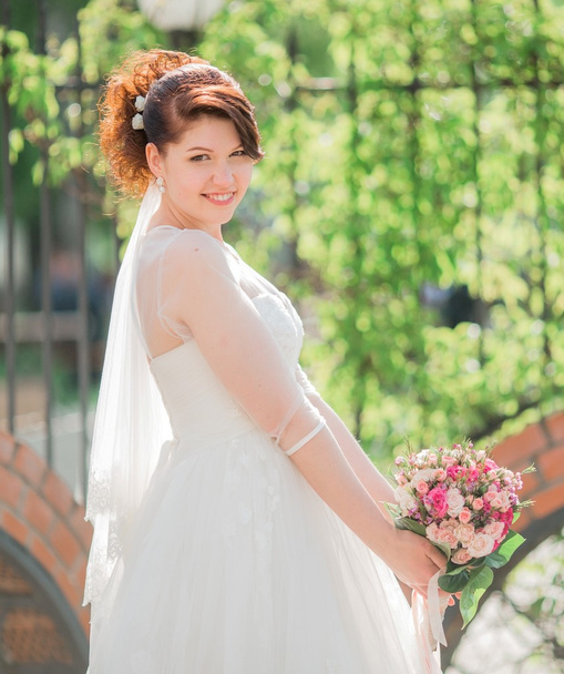 Beautiful bride in white dress - Фото, зображення