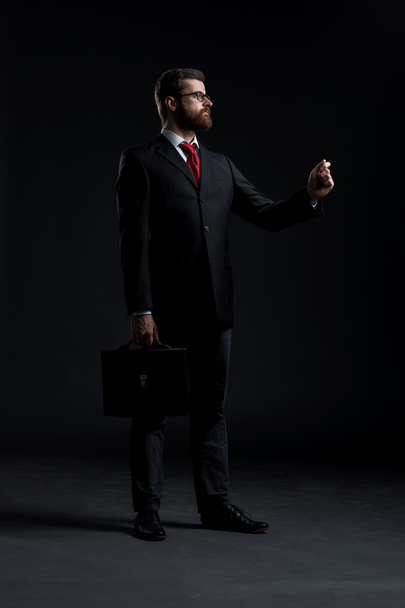 Businessman on black background - Foto, Imagem