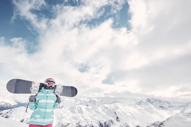 Young woman with snowboard - Fotoğraf, Görsel