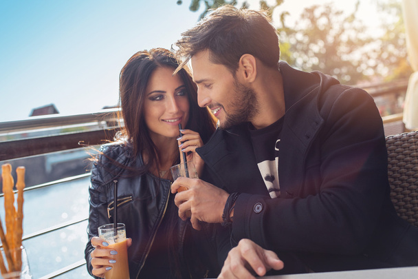 Loving couple in outdoor cafe - 写真・画像