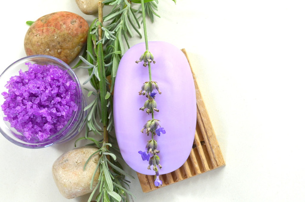 Natural soap with lavender on a stand, sprigs of lavender, sea salt with lavender - Photo, Image