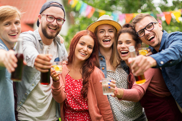 happy friends with drinks at summer garden party - Valokuva, kuva