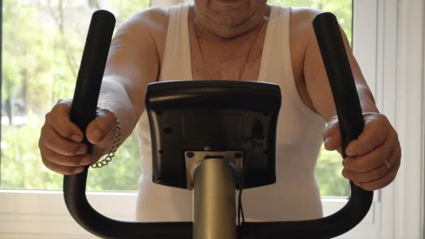 Close Up The Old Man Riding Stationary Bike - Footage, Video