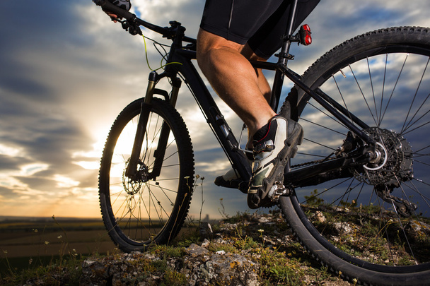 Closeup of cyclist man legs riding mountain bike - Foto, immagini