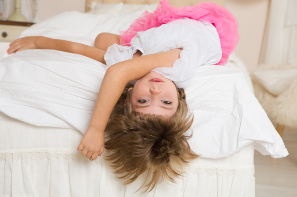 Portrait of cute girl lying  in the bed - Fotografie, Obrázek