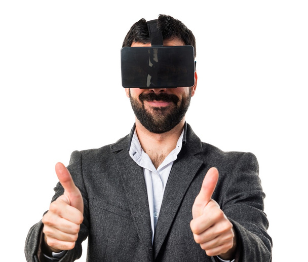 Man using VR glasses with thumb up - Foto, Imagen