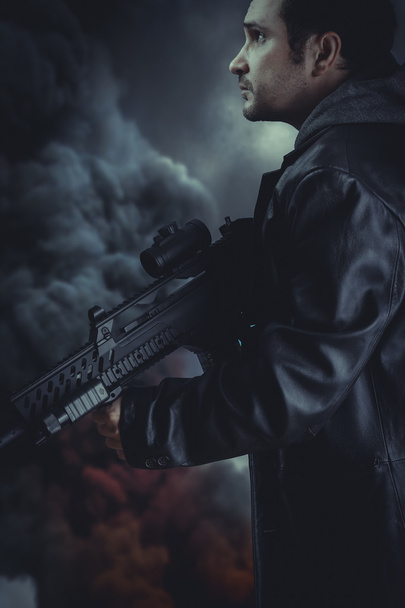 Man holding  assault rifle - Fotografie, Obrázek