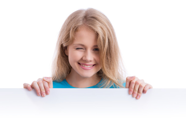 beautiful blond girl holding an empty white board  - Фото, изображение
