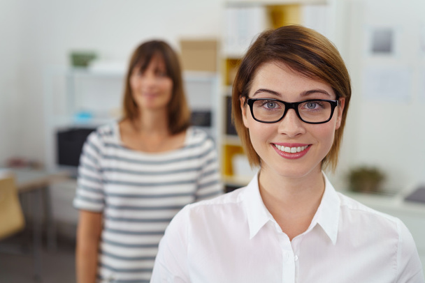 Close up of smiling female boss wearing glasses - Фото, изображение