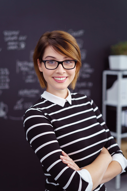 Female analyst wearing glasses and striped sweater - Фото, изображение