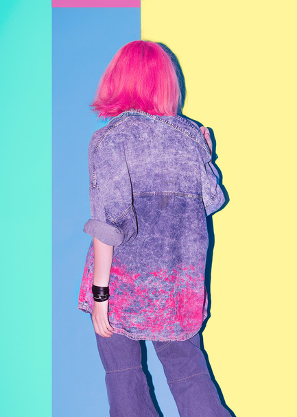 Fashion hair color. Pink hair and jeans wear. stylish girl - 写真・画像