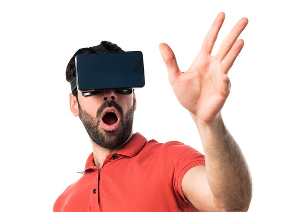 Surprised man using VR glasses - Fotó, kép