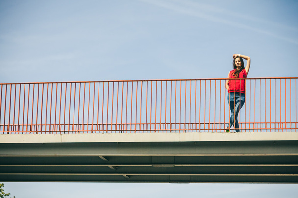 Girl on bridge in city. - Valokuva, kuva
