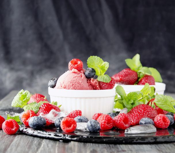 fruit ice cream with fresh strawberries, blueberries and raspberries - Photo, Image
