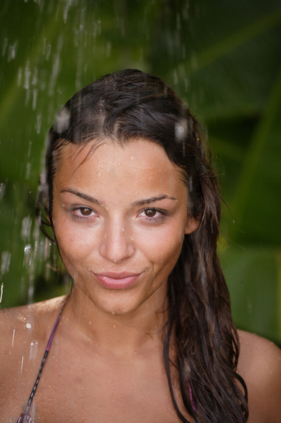 woman in tropical shower palms around - Φωτογραφία, εικόνα