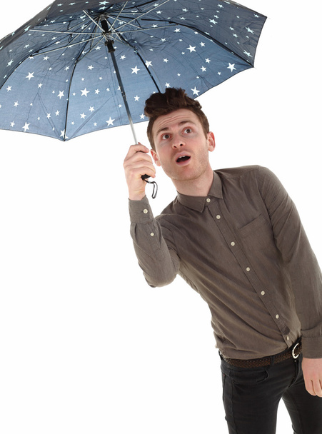 Komea mies sateenvarjon kanssa.
 - Valokuva, kuva