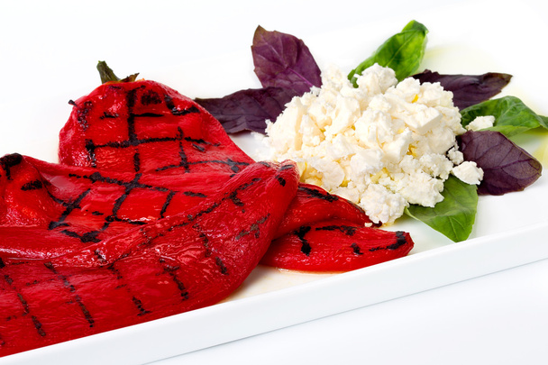 A dish of grilled red pepper and cheese - Photo, Image