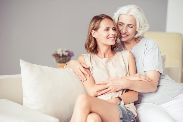 Joyful aged woman resting with her adult daughter - Photo, Image