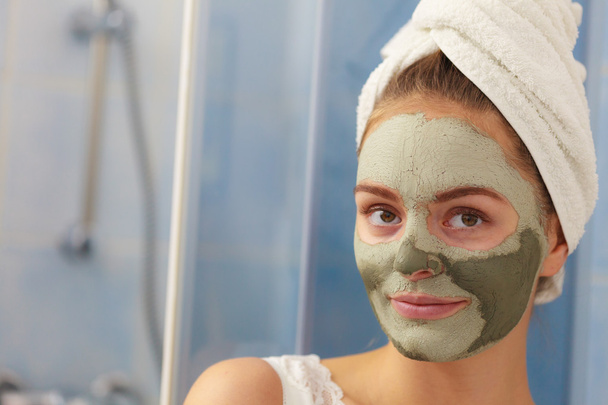 Woman face with green clay mud mask  - Φωτογραφία, εικόνα