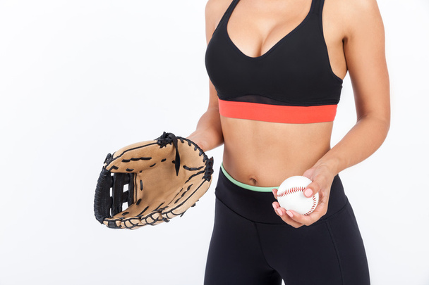 Woman's torso with baseball glove and ball - Foto, afbeelding