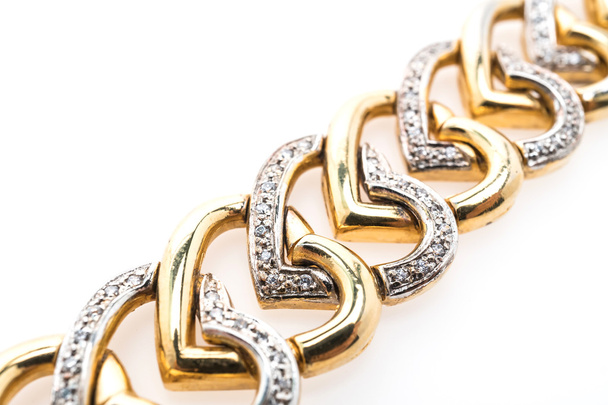 Золотой браслет и бриллиантовые украшения
 - Фото, изображение