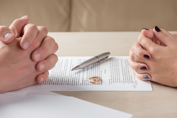 wife and husband signing divorce documents or premarital agreement - Photo, Image