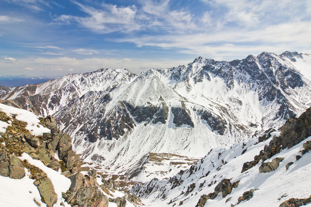 Landscape of the peaks of the Eastern Sayan in the snow - Photo, image