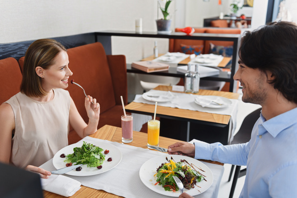Man and woman having lunch at cafe - Photo, Image